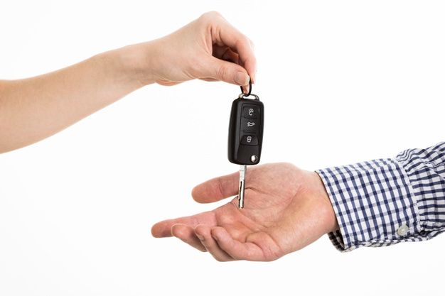 hands exchanging car keys free photo